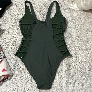 One pice and high cut swimsuit, dark green, size M, used 3 times